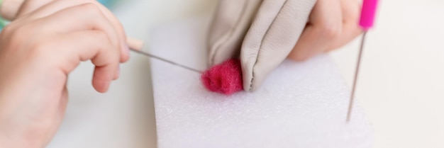 Close up of needle and thread on fabric